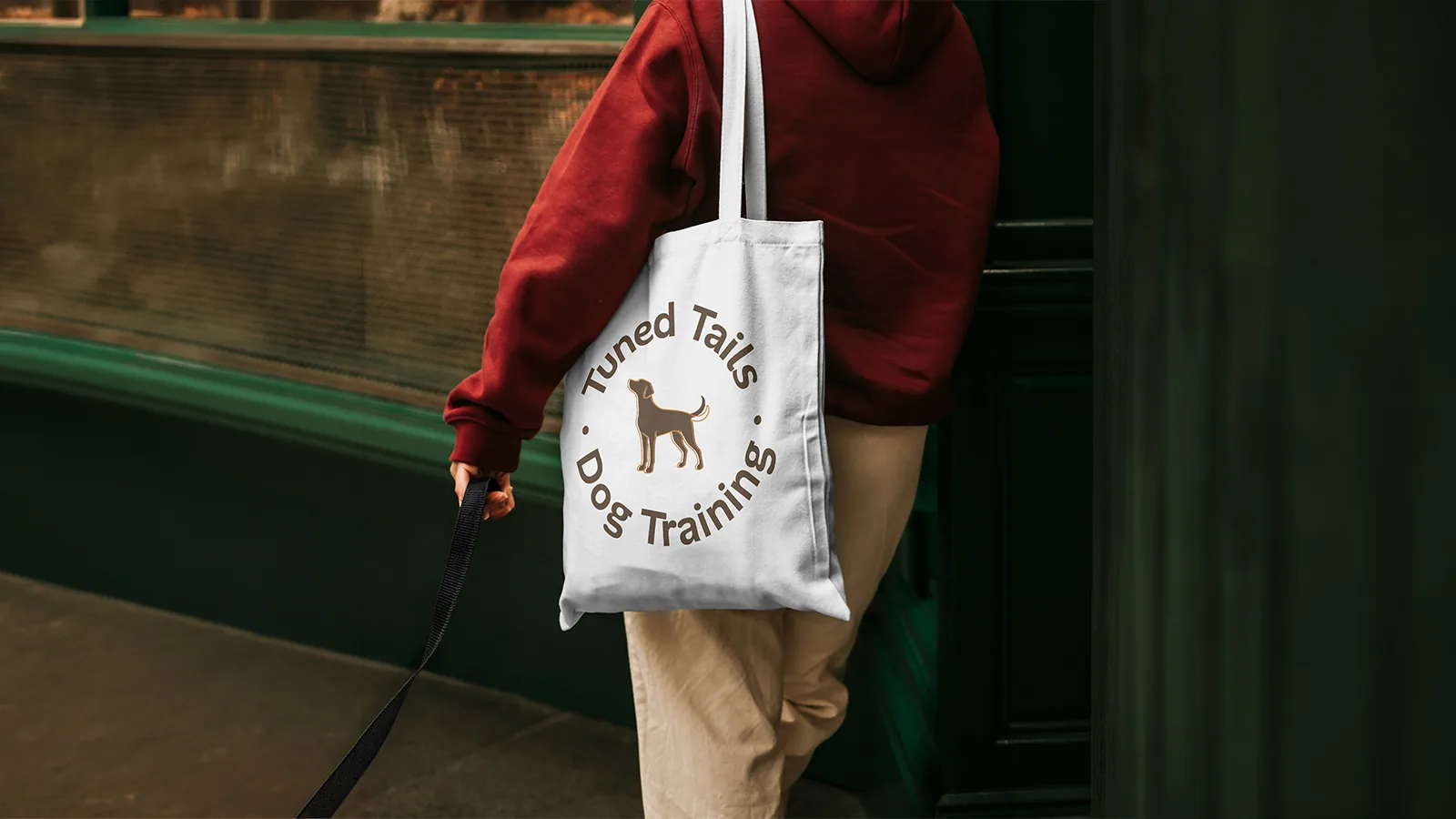 Tuned Tails Dog Training logo on a tote bag